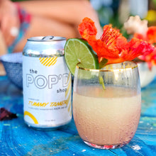 Load image into Gallery viewer, Tummy Tamer Ginger, Lime, Cayenne pepper drink in a can and glass.