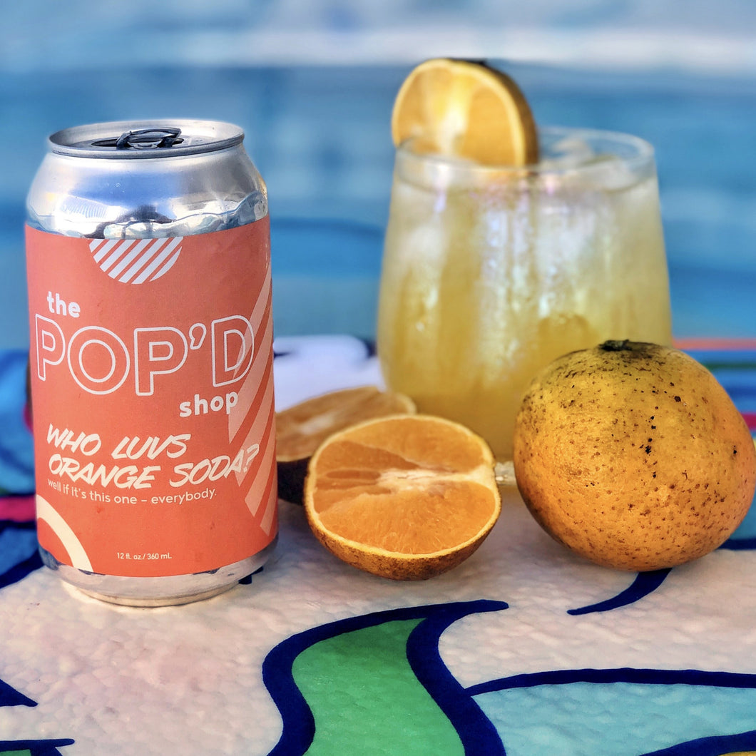 Image of Orange Soda and oranges in a pool.